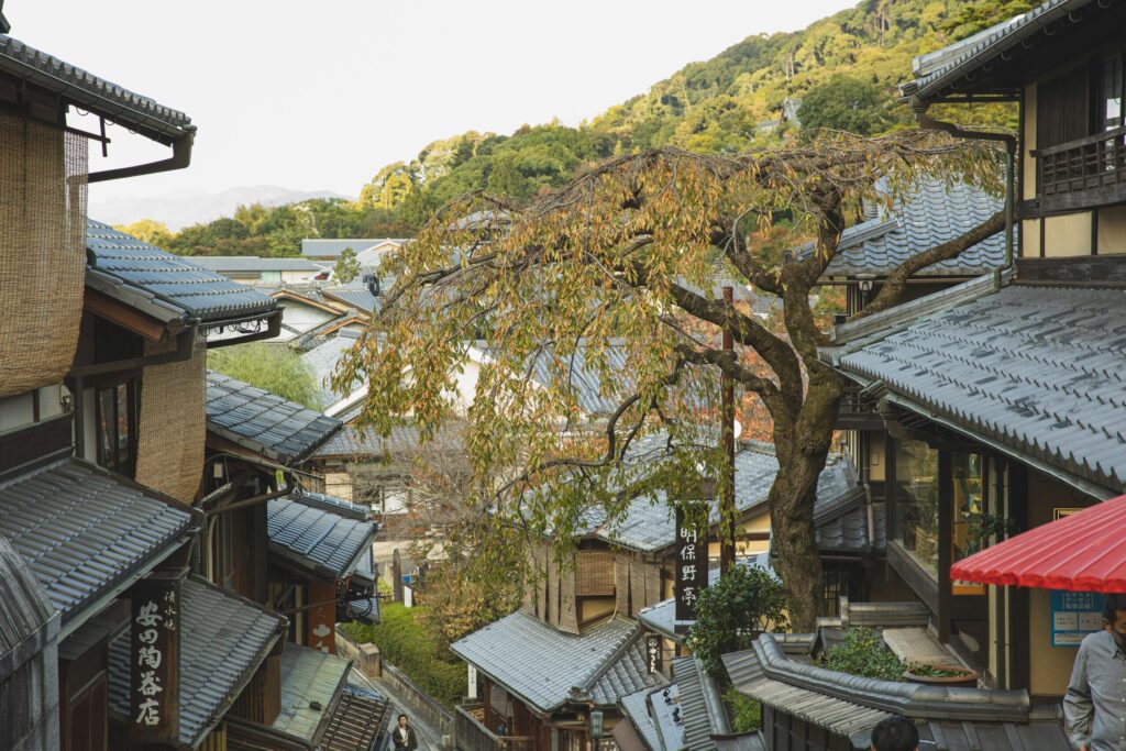 View of a historic street in Kyoto, Japan, showcasing traditional Japanese architecture and scenic urban landscape.